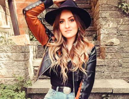 Katy Hurt Leather Jacket, western style with cowboy hat, British country music